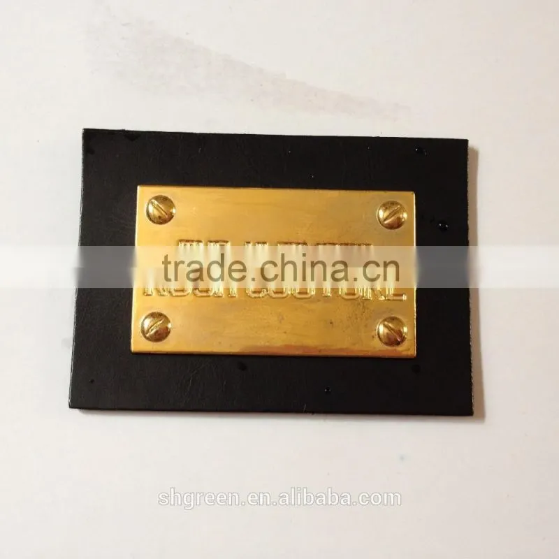 Promotional white real leather label with engraved logo metal plate