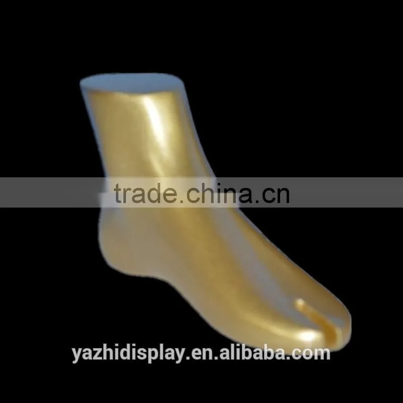 Fashion shoes display Golden mannequin feet and foot