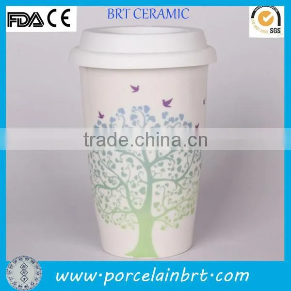 white ceramic travel mug with silicon lid