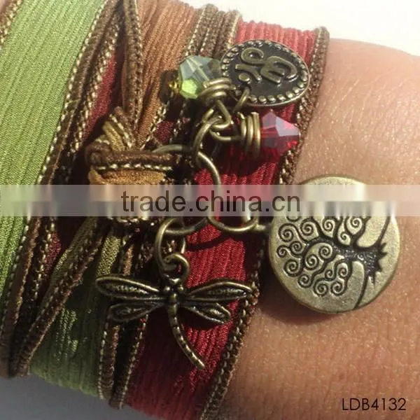 Fashion ribbon bracelet with gold plated dragonfly and tree china supplier