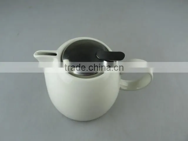 white round porcelain tea pot with stainless steel lid