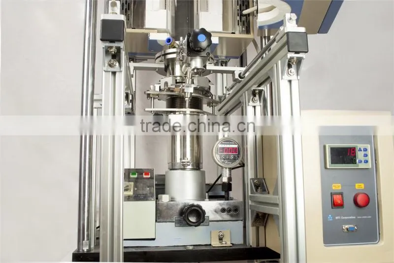 Vacuum heated pressing furnace for making dense compound materials