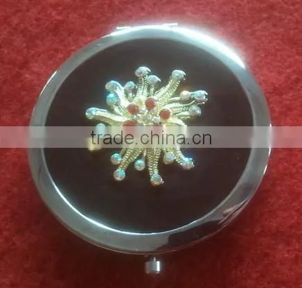 black handmade compact mirror with metal octopus decor