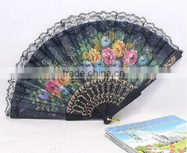 Spanish style plastic folding fan with flower
