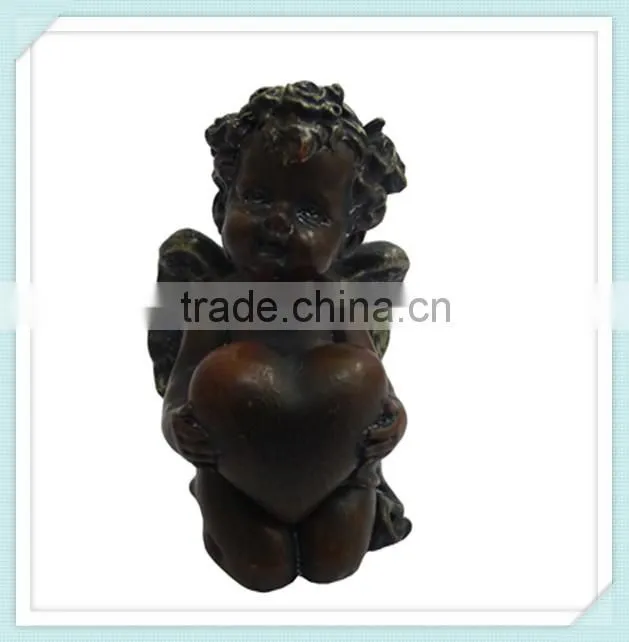 lovely happy angel cute doll holding a heart