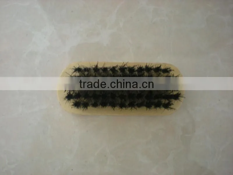 small wooden shoe brush