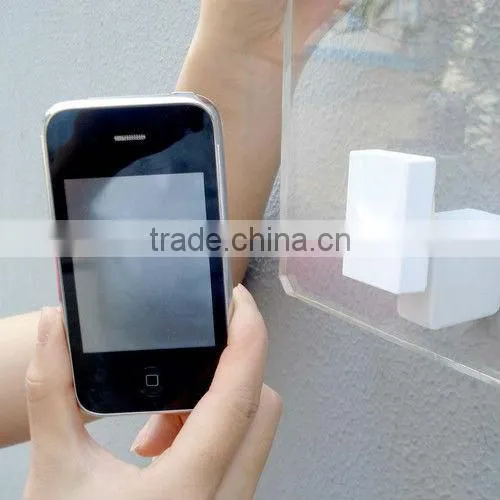 Retractale security wall mount cell phone holder