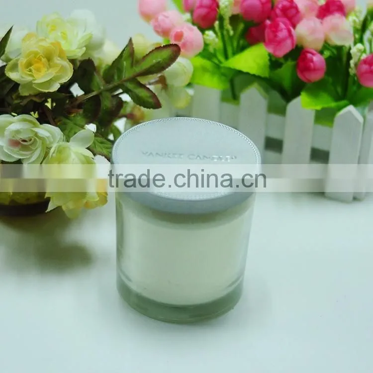 Scented candle in glass jar with metal lid