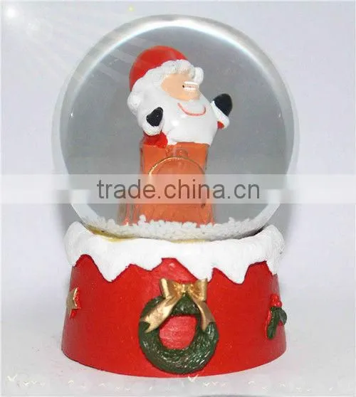 Resin santa snow globe with blowing snow
