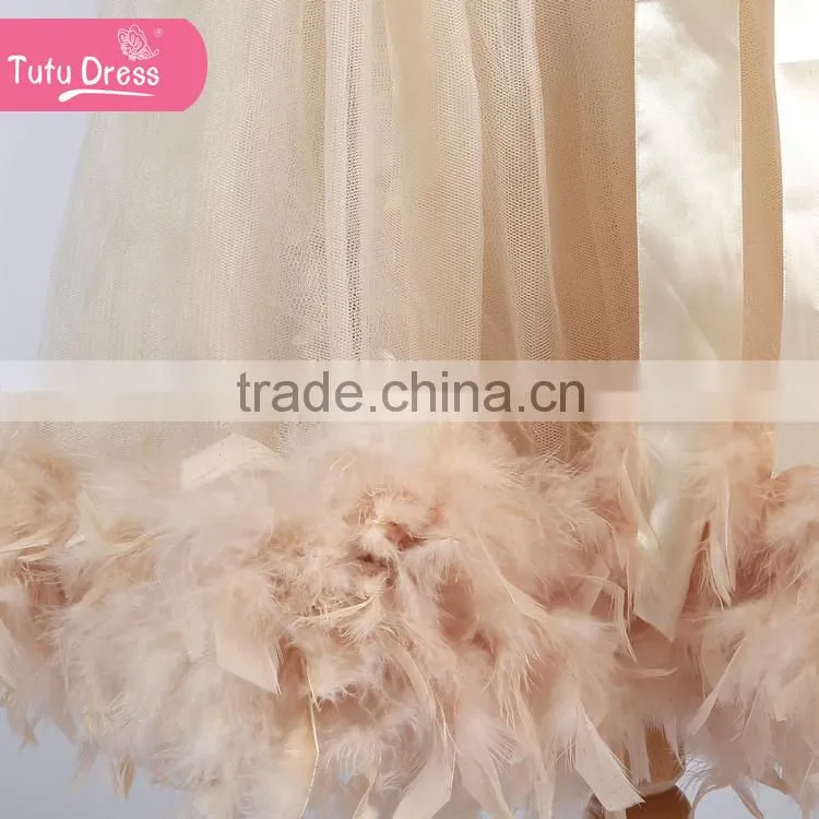 The ivory color girls boutique dress with fluffy feather