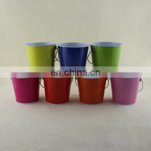 small colorful metal pail with handle