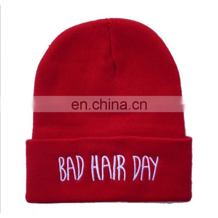 Qianzun orange and blue beanie hat with pom pom