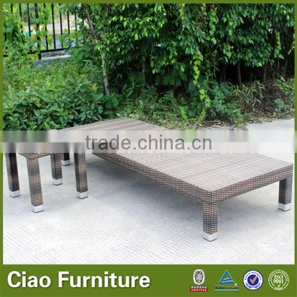 Outdoor used beach sun lounger with side table