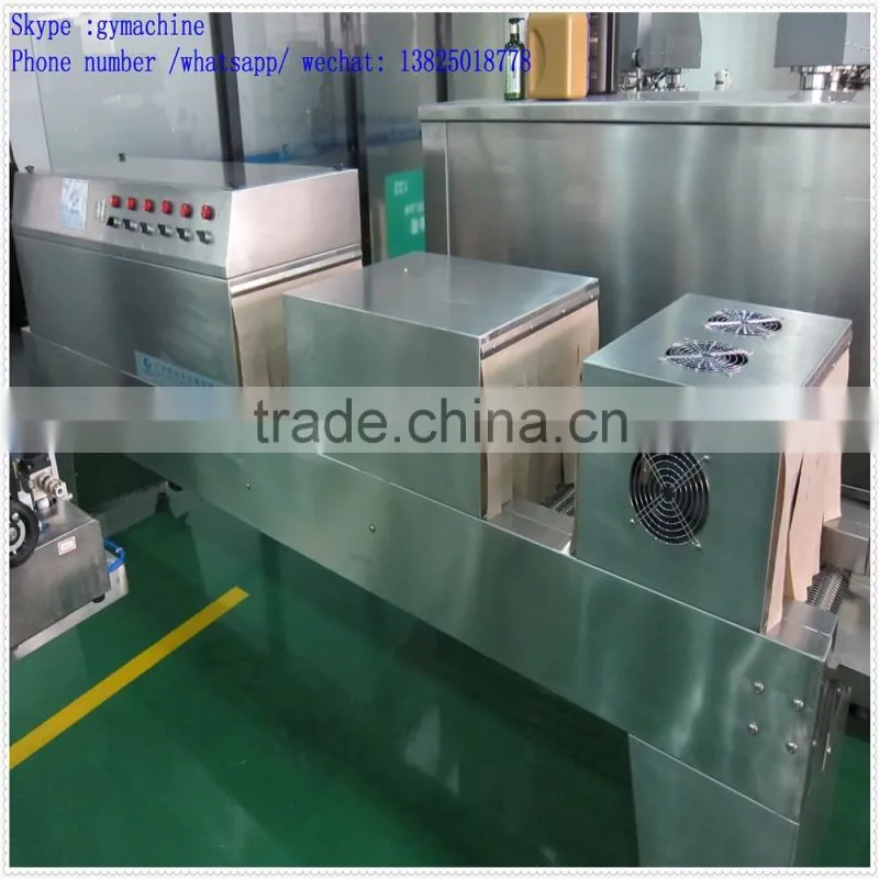 Automatic over wrapping heat shrinking machine