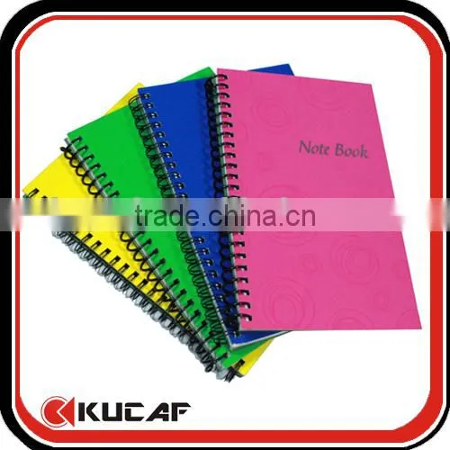 Spiral binding brown paper notebook with pen