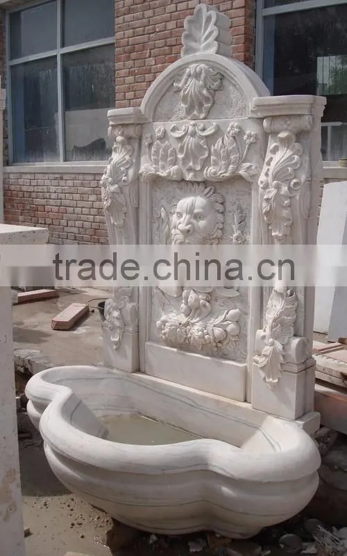 Marble lion head wall fountain