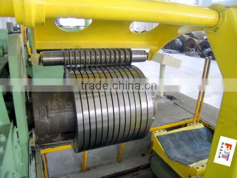 rewinder with hold down arms device