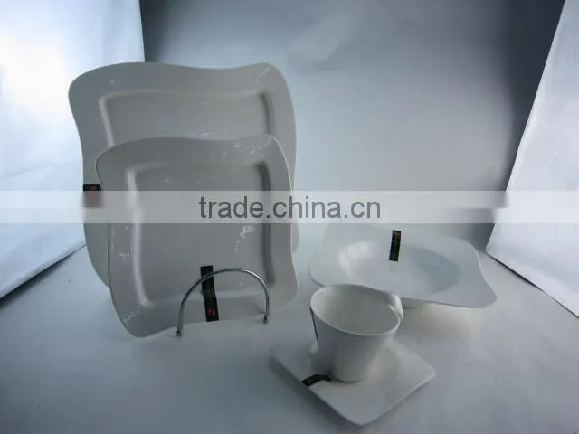 white waved porcelain dinner set with tea pot