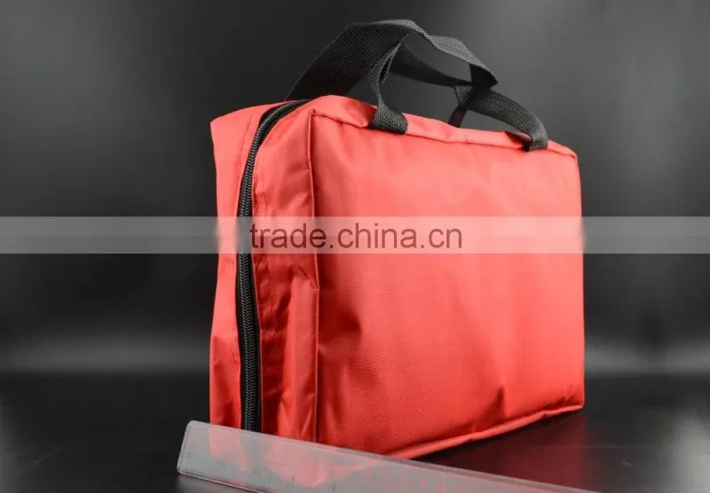 Emergency first aid travel kit in red cross bag for outdoor treatment