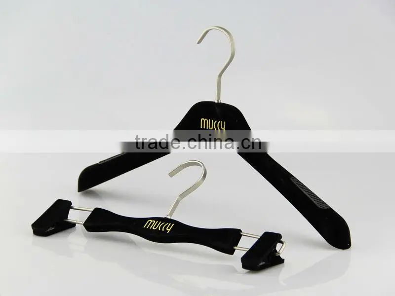 Pink velvet dress hanger with gold stamped logo
