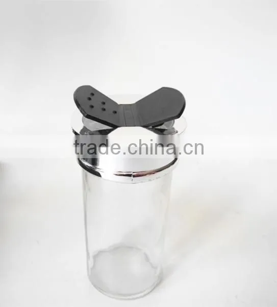 small clear glass paragon spice jars with butterfly cap