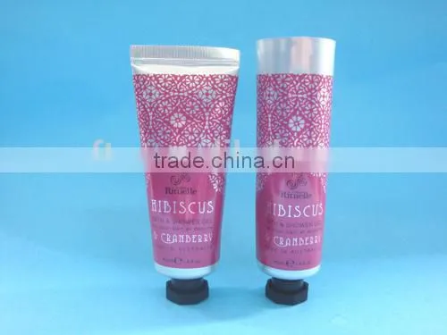 Cosmetic tube with silicone valve flip top