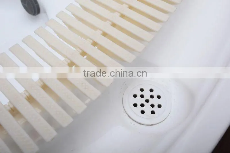 round outdoor spa with overflow