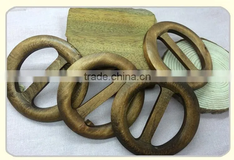 Antique hand carved round wooden belt buckle