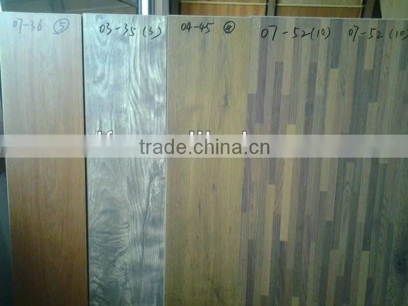 Hand grasps laminated floor