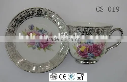 colored cafe tea cup and saucer