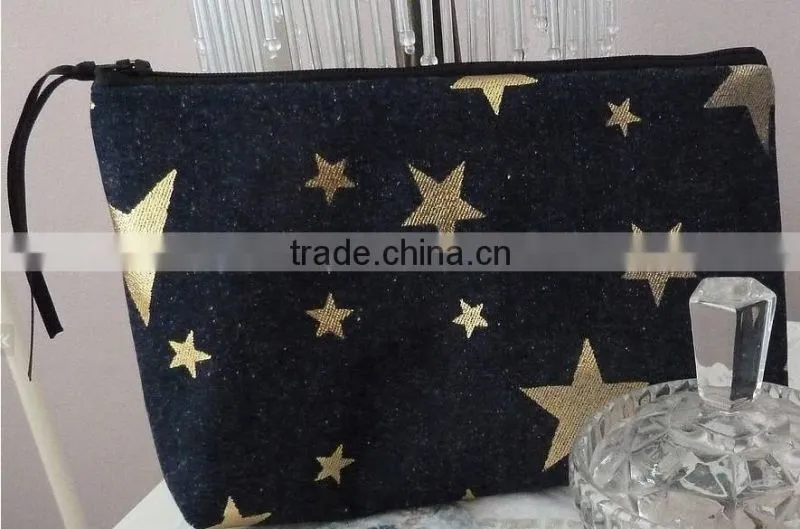 Beautiful zip cosmetic bag made from denim fabric with metallic gold star print