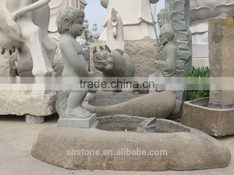 River stone fountain with litter boy statue for garden decoration