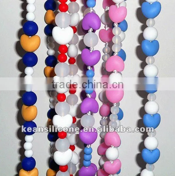 Salmon Orange Chew Silicone Teething Necklaces have a breakaway clasp Make by Food Grade Silicone