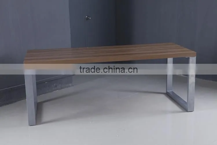 Long narrow stainless steel feet with wooden dining table