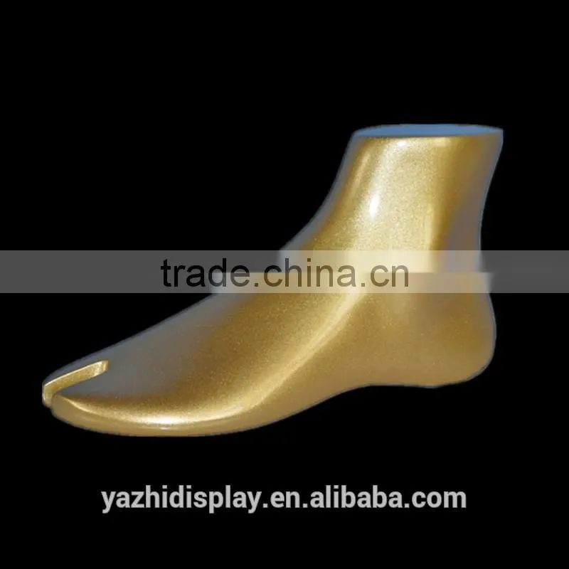 Fashion shoes display Golden mannequin feet and foot