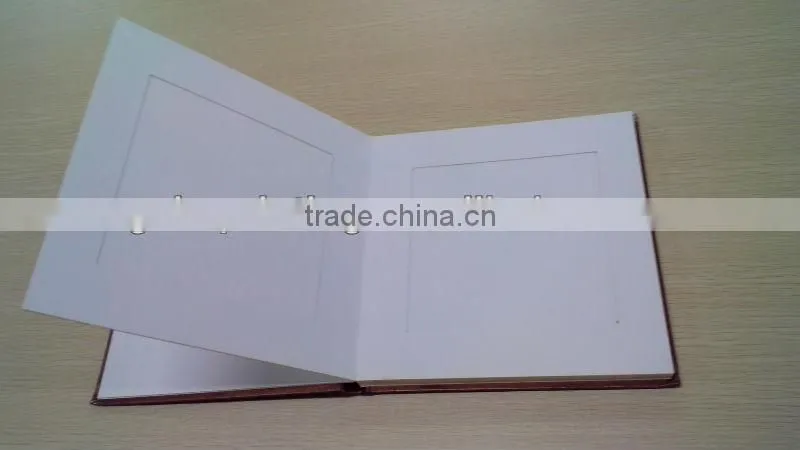 Photo album with brown hard cover and duplex board