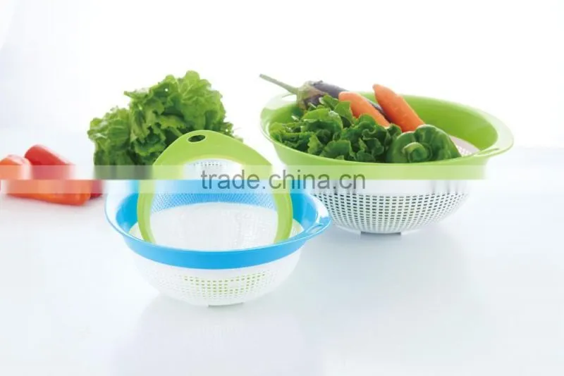 green and blue color plastic rice sieve