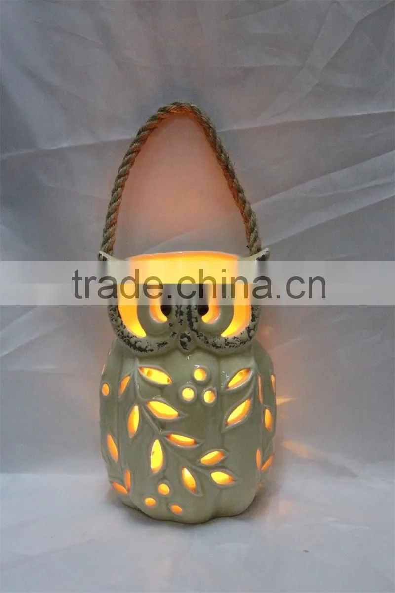 White ceramic owl shaped tealight candle holder