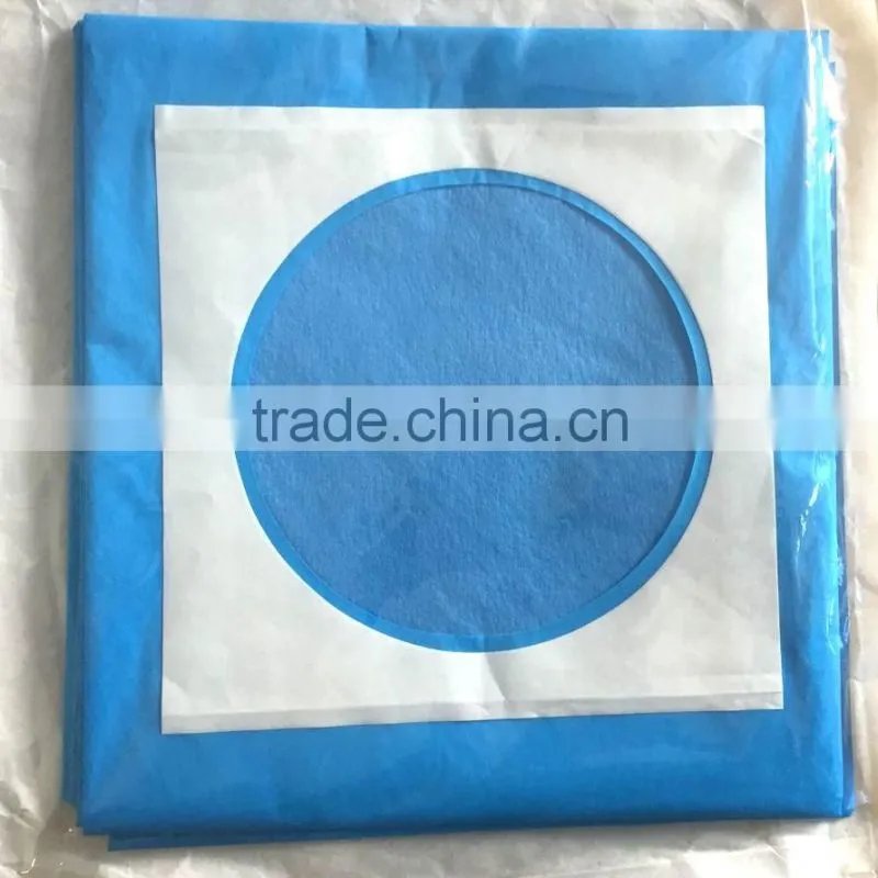 Disposable surgical drape with hole