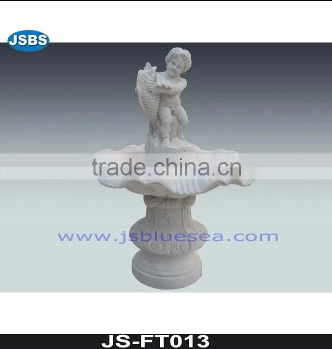 White marble wall fountain with angel