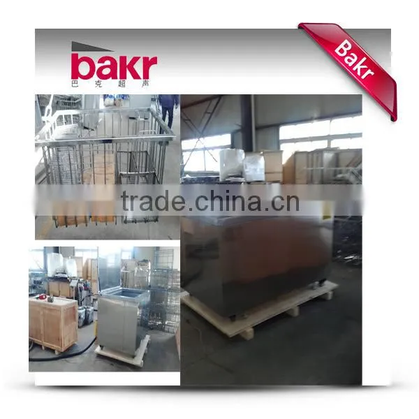 Ultrasonic industrial washing machine for stamped parts