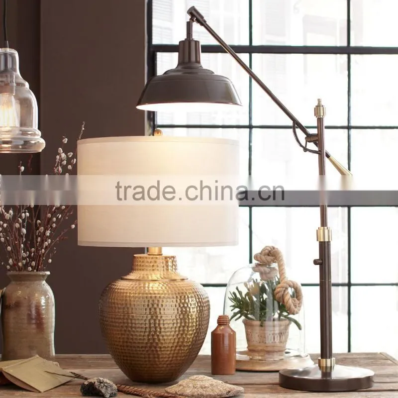11.21-10 Crafted with a traditional silhouette adjustable arm Table Lamp bronze finish for versatility and charm