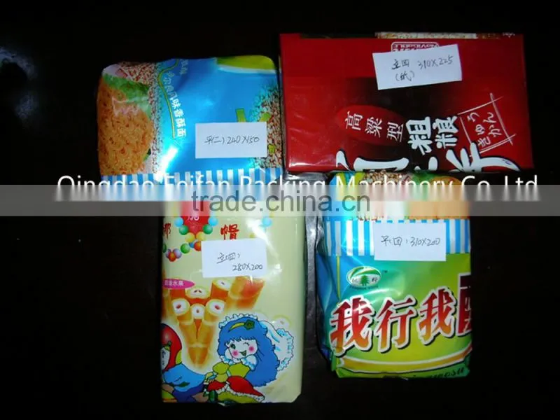 Envelope type biscuit wrapping machine