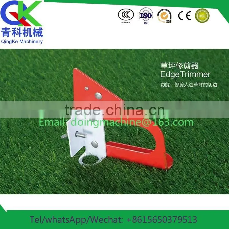 sports field with artificial grass and small cutter