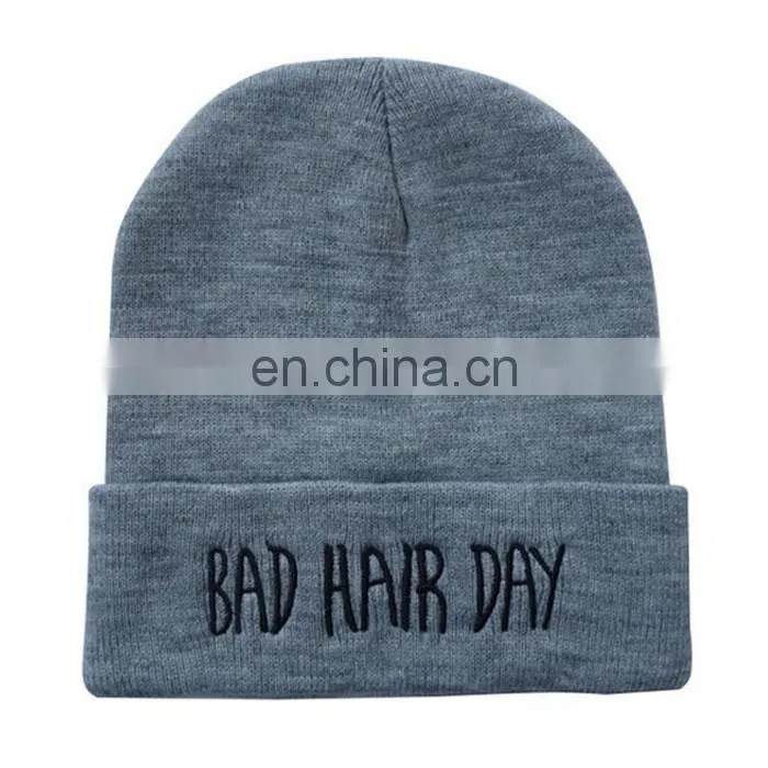 Qianzun orange and blue beanie hat with pom pom