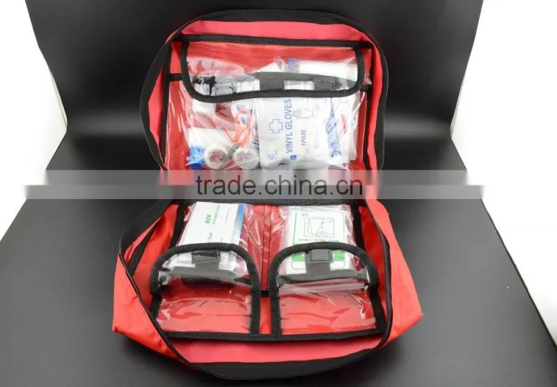 Emergency first aid travel kit in red cross bag for outdoor treatment