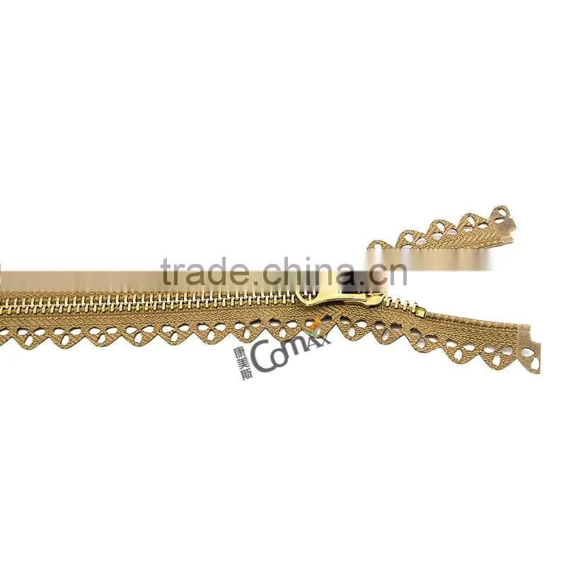 One close Euro style shiny gold metal zip for bag