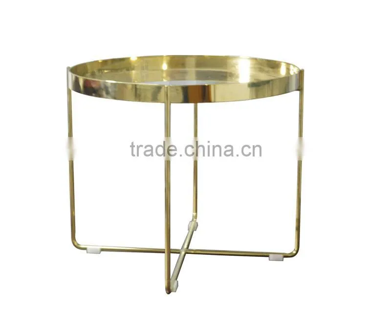 Golden stainless steel round coffee table