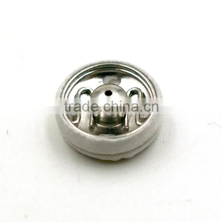 white fabric covered parts two parts snap buttons