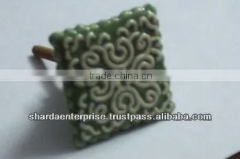 ceramic white knob with green circles